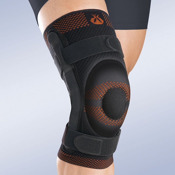 CLOSED PATELLA KNEE BRACE W/ SILICONE PAD AND POLYCENTRIC REINFORCEMENTS